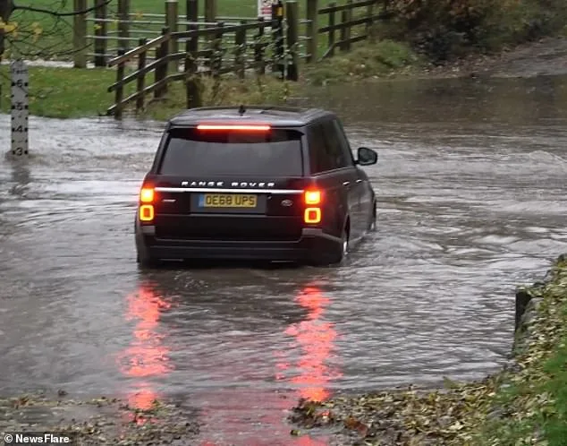 Range Rover Driver Ignores Flood Warning Signs at Birmingham Ford