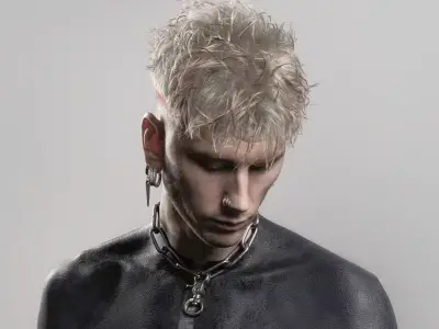 MGK Reveals Gruesome Side Effects of Blackout Body Tattoo