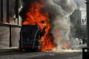 Belfast Bus Set Ablaze by Masked Protesters After Stabbing Attack