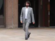 Burglar booted down woman's door, put in headlock by sons, spared jail