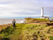Clifftop Walk on Wales' Jurassic Coastline with Lighthouse and Pub