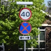 Drivers Urged to Learn Meaning of Red and Blue Cross Road Sign