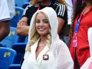 England WAGs Prepare for Rain as Megan Davison Wears All-White with Poncho