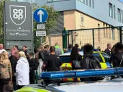 Girl, 14, arrested after stabbing at Manchester school leaves three injured