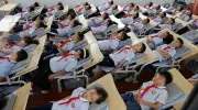 Global Snapshots: Classroom Naps, Wildfires, and Migrant Rescues