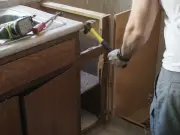 Man Renovating House Discovers 40-Year-Old Crisps Behind Kitchen Unit