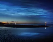 Noctilucent Clouds: The Enigmatic Summer Phenomenon from Space's Edge