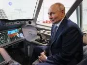 Putin Lovingly Strokes Cockpit in Bizarre Inspection Visit