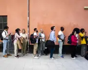 Queueing as Social Trend: From Pastry Lines to Recession Prep