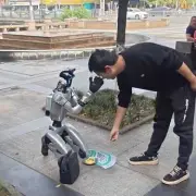 Robot Begs for Cash on Knees in China After Hitting Rock Bot-Tom