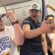 Ryanair passengers throw aisle party after woman hurls bottle at fellow flyer