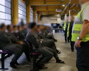 Staff at UK immigration detention centre wore England flags, report finds