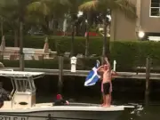Tartan Army Fans Sail Florida Creek Playing Bagpipes and Flying Saltire