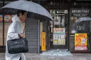 Typhoon Jangmi Slams Japan, Triggering Flood Warnings and Travel Chaos
