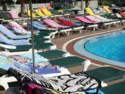 Woman's Petty Revenge on Sunbed Thief at All-Inclusive Resort Sparks Debate