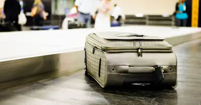Airport worker shares hack to get suitcase first off plane but warns of risk