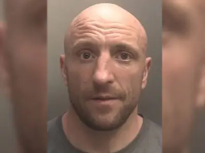Burglar hid in bush with socks on hands after school raid