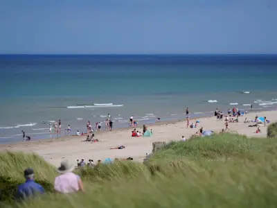 Holidaymakers Ditch Cornwall for Quieter Bamburgh Beach in North East
