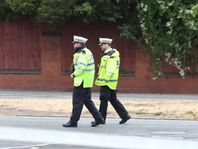 Huyton crash: Police cordon after car hits lamppost on Liverpool Road