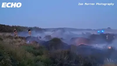 Large fire breaks out on Hightown Dunes, firefighters remain on scene