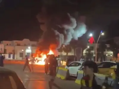 Migrants storm Melilla border sparking fires and chaos