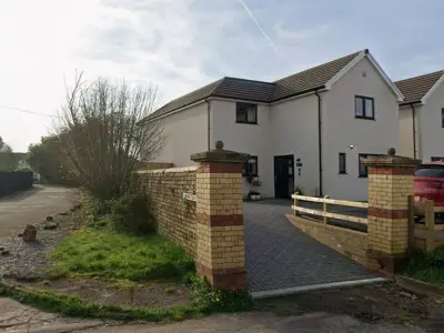 Newport Homeowner Wins Right to Lower Historic Wall Despite Objections
