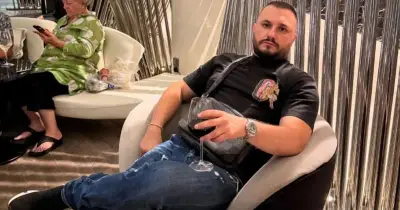 Twice-deported Albanian criminal flaunts cash on social media after sneaking back into UK