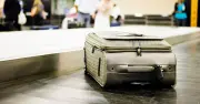 Airport worker shares hack to get suitcase first off plane but warns of risk