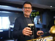 Andy Burnham sinks pints as PM unveils pub rescue package