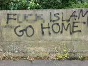 Anger as racist graffiti remains on Bury bridge for weeks