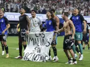 Argentina players breach FIFA rules with Falklands banner after England win