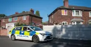 Boy, 16, arrested after woman dies in Manchester house
