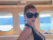 Brooks Nader Risks Wardrobe Malfunction in Plunging Top on Yacht