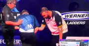 Cameron Menzies forced to abandon darts match for medical help after near collapse