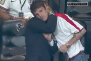 Cruz Beckham comforts David after England World Cup semi-final defeat