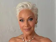 Denise Welch stuns in pink satin gown at son Matty Healy's wedding