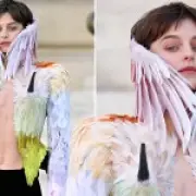 Emma Corrin's Feather Jacket with Pointed Nipples Steals Schiaparelli Show