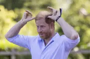 Harry guards 'crown jewels' during goat yoga at children's charity event