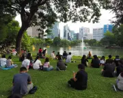 Hundreds gather in Bangkok to 'just sit and do nothing' in protest of hustle culture
