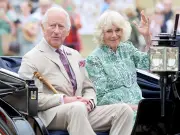 King Charles swats fly at Sandringham Flower Show with Queen Camilla