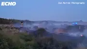 Large fire breaks out on Hightown Dunes, firefighters remain on scene