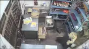Leopard bursts into Indian shop and attacks cashier in terrifying CCTV footage