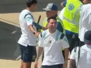 Lionel Messi laughs uncontrollably as airport security confiscates teammate's item
