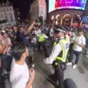 Lone Argentina fan rescued by police in London after England fans swarm him