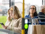 Man Confronted for Not Using Headphones on Bus Sparks Debate