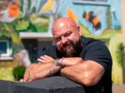 Man transforms home into Britain's most colourful house with nature mural
