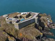Man visits Welsh island fortress owner's farewell party after £3m listing