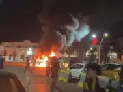 Migrants storm Melilla border sparking fires and chaos