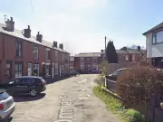 Murder Probe in Bolton After Man, 75, Found Dead; Woman Arrested