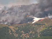 Over 80,000 evacuated as wildfires rage in France and Spain